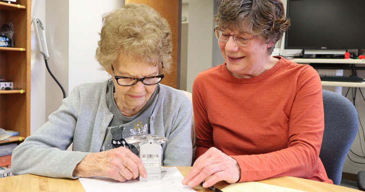 picture of elderly woman receiving tax help