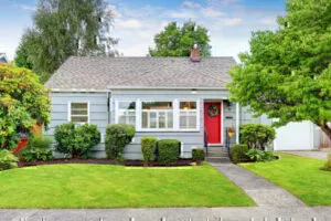 Light Blue Residential House with Red Door