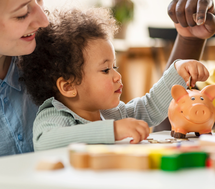 mother and child playing with piggy bank toy