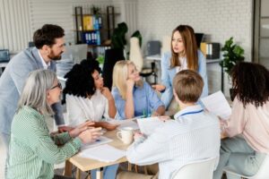 a group of diverse professionals meeting around a table