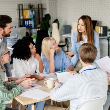 a group of diverse professionals meeting around a table