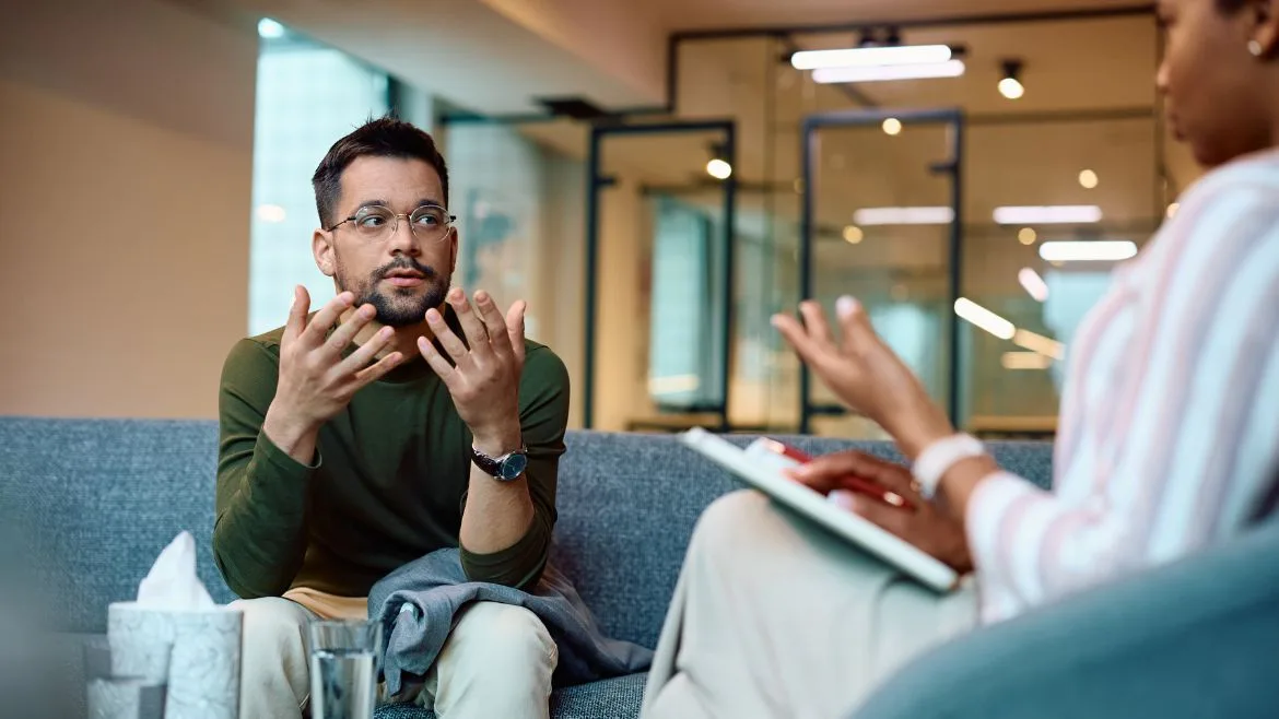 A man speaking during his financial counseling session.