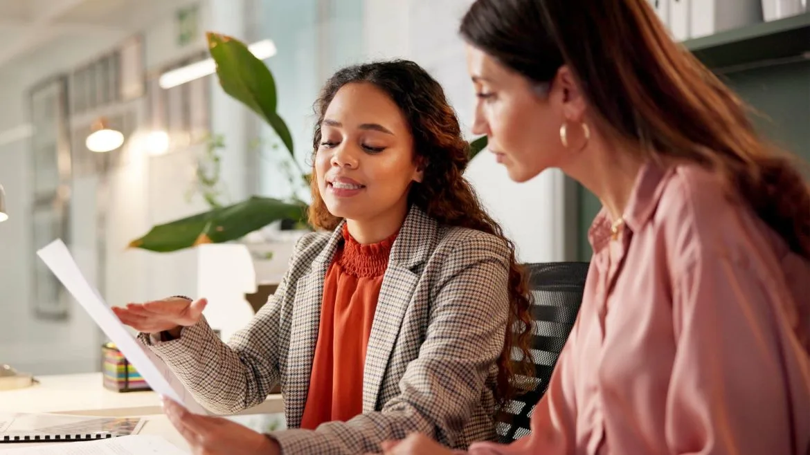 Two women having a conversation about finances.