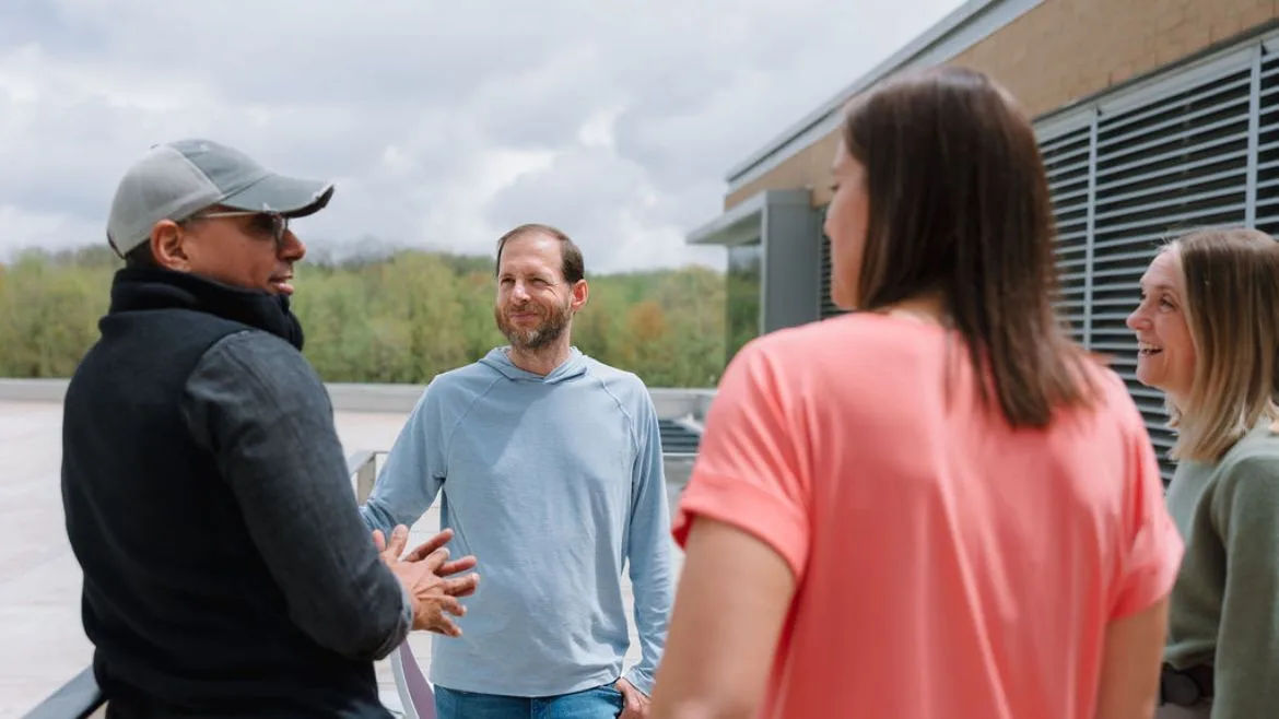 GreenPath employees talking to one another.