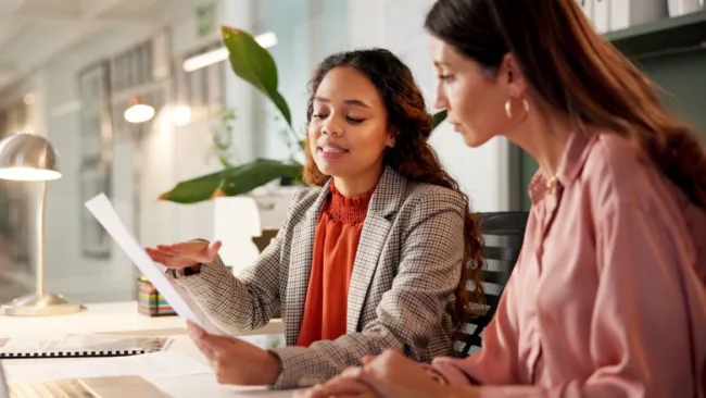 An employee talking to a GreenPath financial counselor