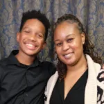 DMP client Angela posing with her son.