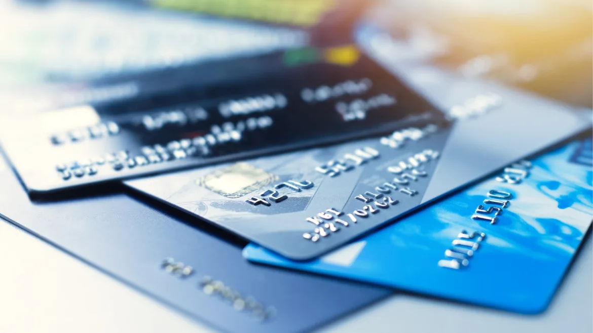 different credit cards laying out on a table